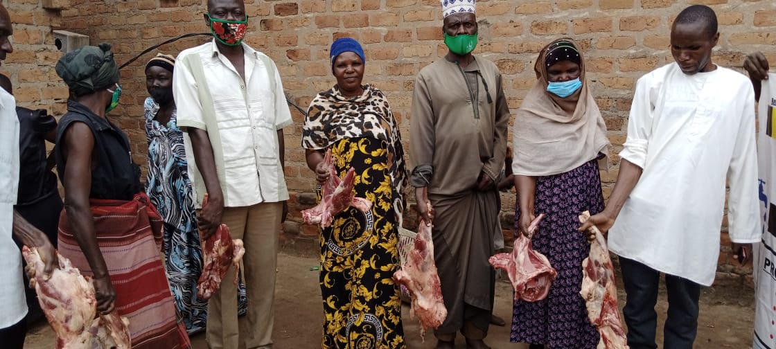 Community members receiving meat distribution support